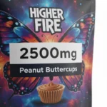 Alt: Higher Fire Shatter Peanut Buttercups 2500mg pouch on a light stone surface with natural lighting.