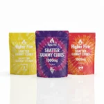 Higher Fire Shatter Gummy Cubes 1000mg flavour lineup with pineapple, grape and cherry pouches standing in a row